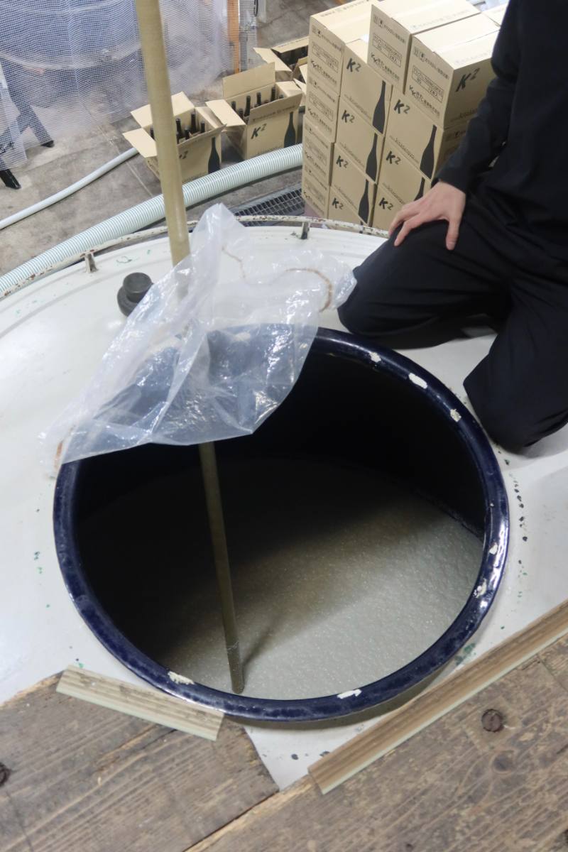 Looking into a brewing tank at a sake brewery