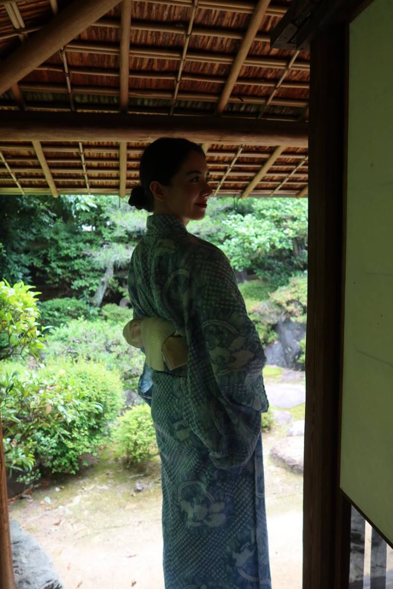 In a shibori yukata by a garden