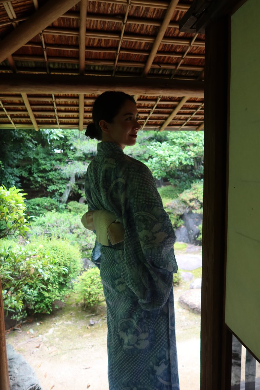 In a shibori yukata by a garden